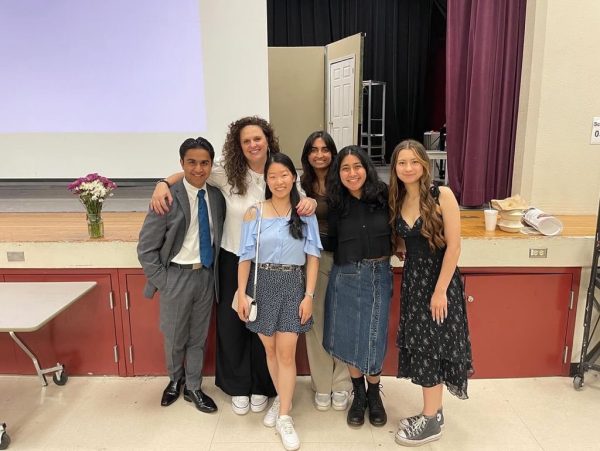 The outgoing EICs [left to right] Zenil Koovejee, Aileen Hu, Ritika Gupta, Zaynah Shah, and Audrey Combs take a picture with journalism advisor Wendy Connelly to commemorate their last banquet.
