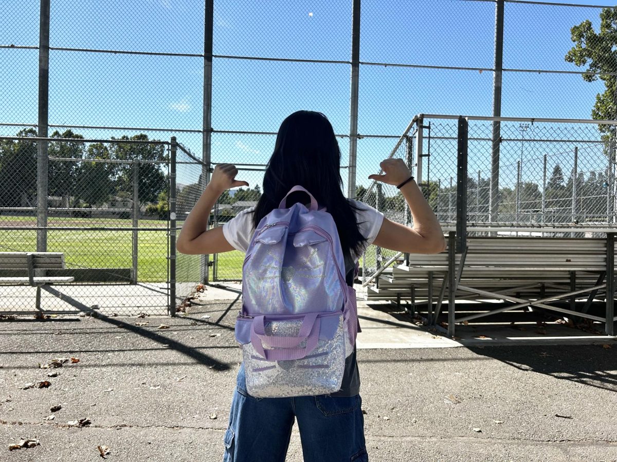 Jeannie Han ('25) displays her school spirit as a senior with her own kid backpack.