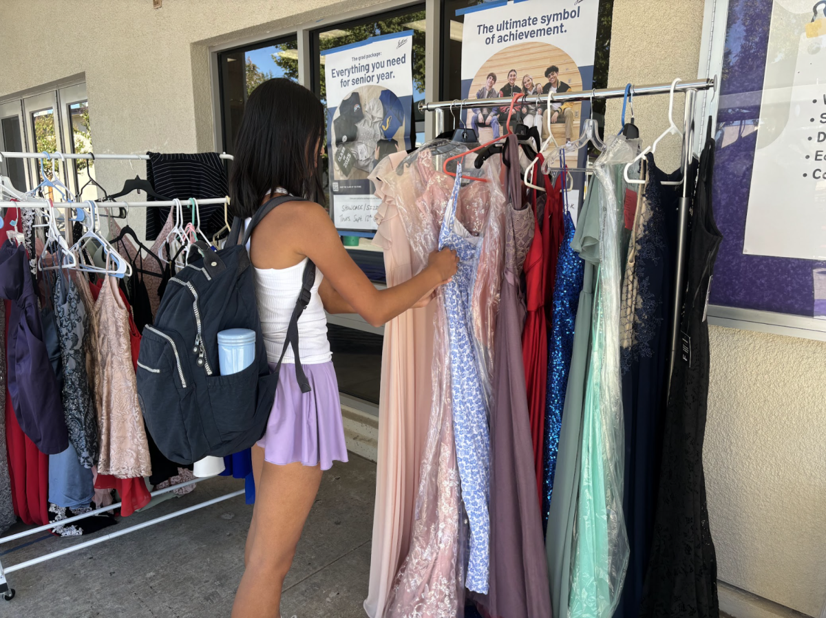 Sarina Liu (‘27), searches for the perfect dress to become her homecoming companion. 
