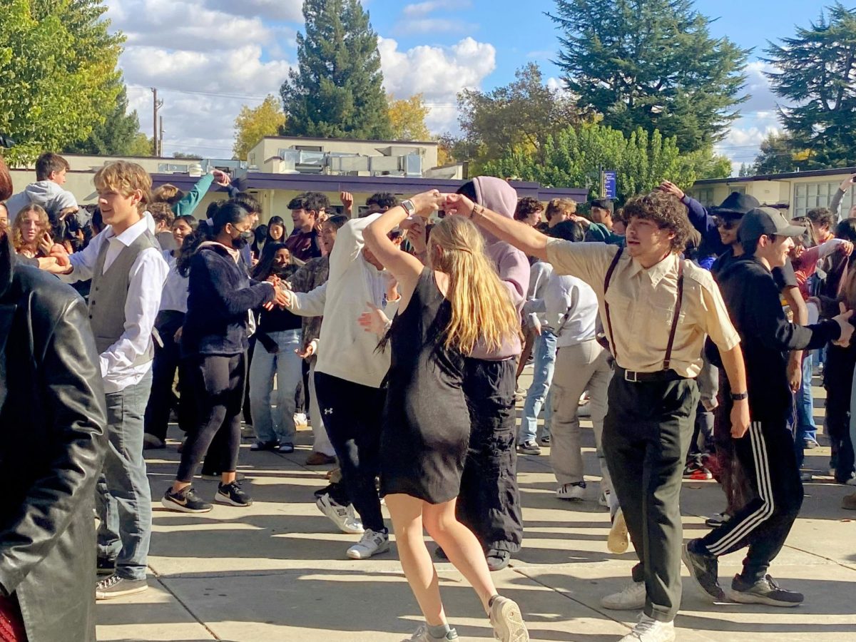 The juniors dance at the annual 1920s Charleston Dance, held in front of the library.