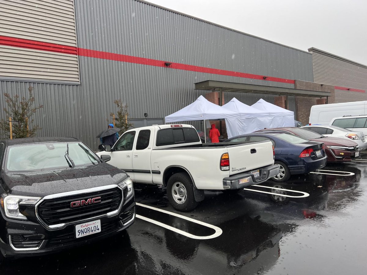 Around the side of the building, employees had a white tent propped up to try and get new employees.