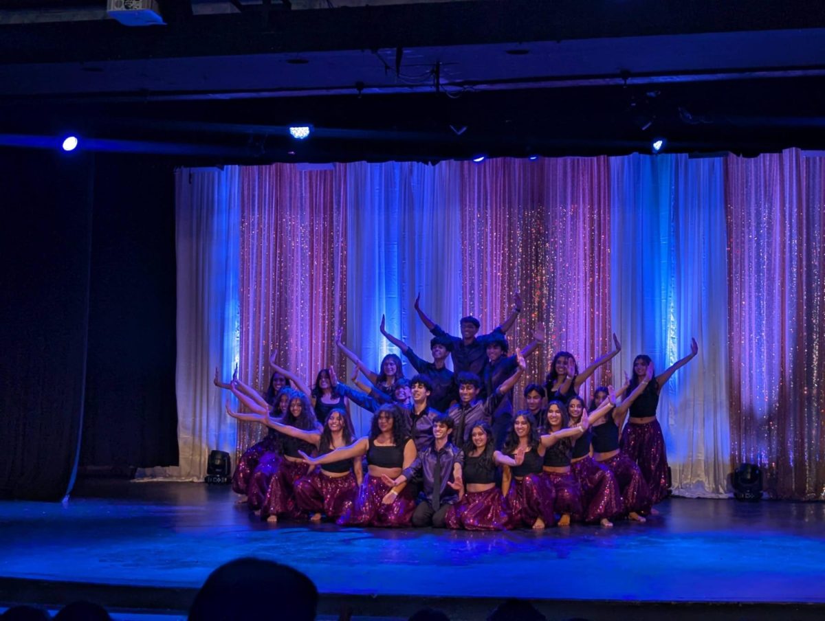 Dhamaka hits their final pose, beaming after performing their thrilling routine on Irvington's stage.