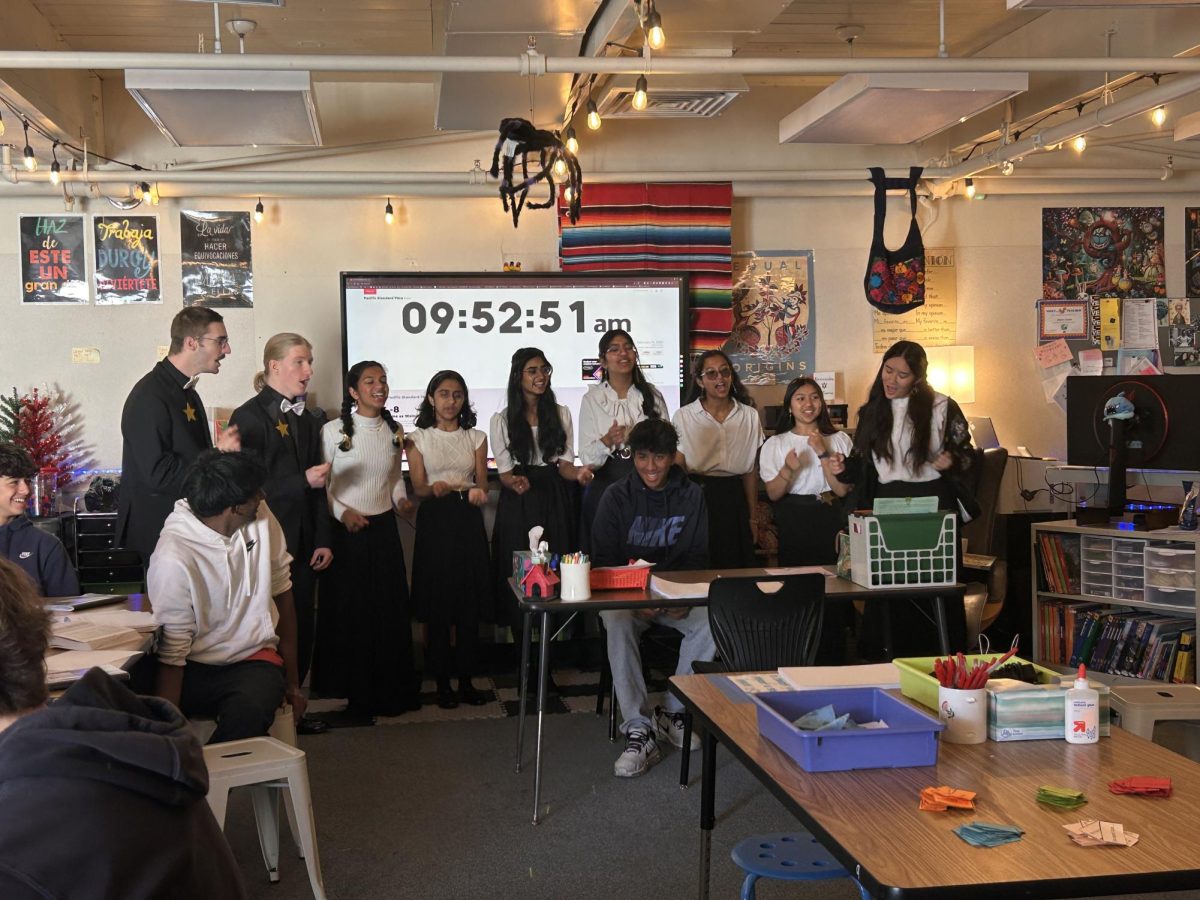 Singing Valentine’s group, “To the Moon and Back” sings various songs about love to Mrs. Cuevas’s class.