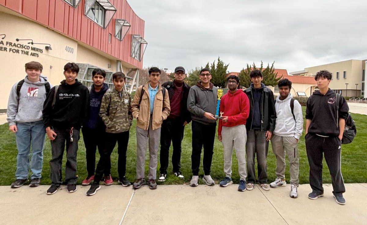 Amador Valley’s Science Bowl team celebrates their success with a trophy in hand after a strong performance at regionals. (Photo Courtesy of AV Science Bowl)